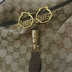 Gold tone hoop style Earrings